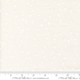 White fabric with a subtle pattern and a ruler at the bottom for scale.