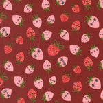 Pattern of cartoon strawberries with faces on a red background