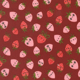 Pattern of cartoon strawberries with faces on a red background
