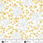 Fabric pattern with spider webs and flowers on a white background, featuring Andover Fabrics branding.