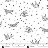 Pattern of black birds and stars on a white background with Andover Fabrics branding.