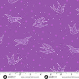 Purple fabric with white bird and star pattern, ruler at the bottom for scale.