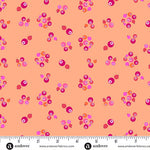 Patterned fabric with pink and orange dots on a peach background, featuring Andover Fabrics branding.