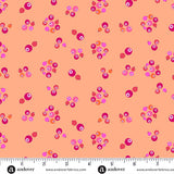 Patterned fabric with pink and orange dots on a peach background, featuring Andover Fabrics branding.