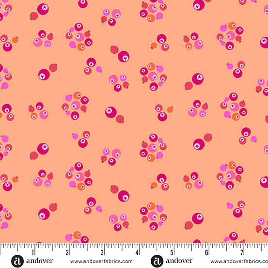 Patterned fabric with pink and orange dots on a peach background, featuring Andover Fabrics branding.