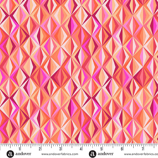 Geometric patterned fabric with a ruler for scale, featuring shades of pink and orange.