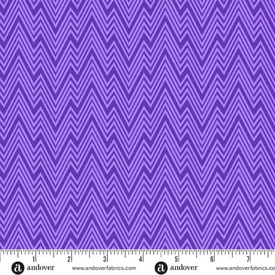 Purple fabric with zigzag pattern and a ruler at the bottom for scale.