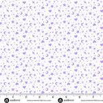 Pattern of stars, hearts, and moons in purple on a white background with a ruler at the bottom.