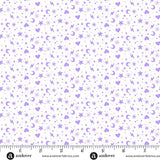 Pattern of stars, hearts, and moons in purple on a white background with a ruler at the bottom.