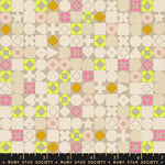 Patterned fabric with geometric shapes and a ruler at the bottom