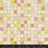 Patterned fabric with geometric shapes and a ruler at the bottom