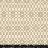 Checkered pattern fabric with a ruler at the bottom, featuring shades of brown and beige.