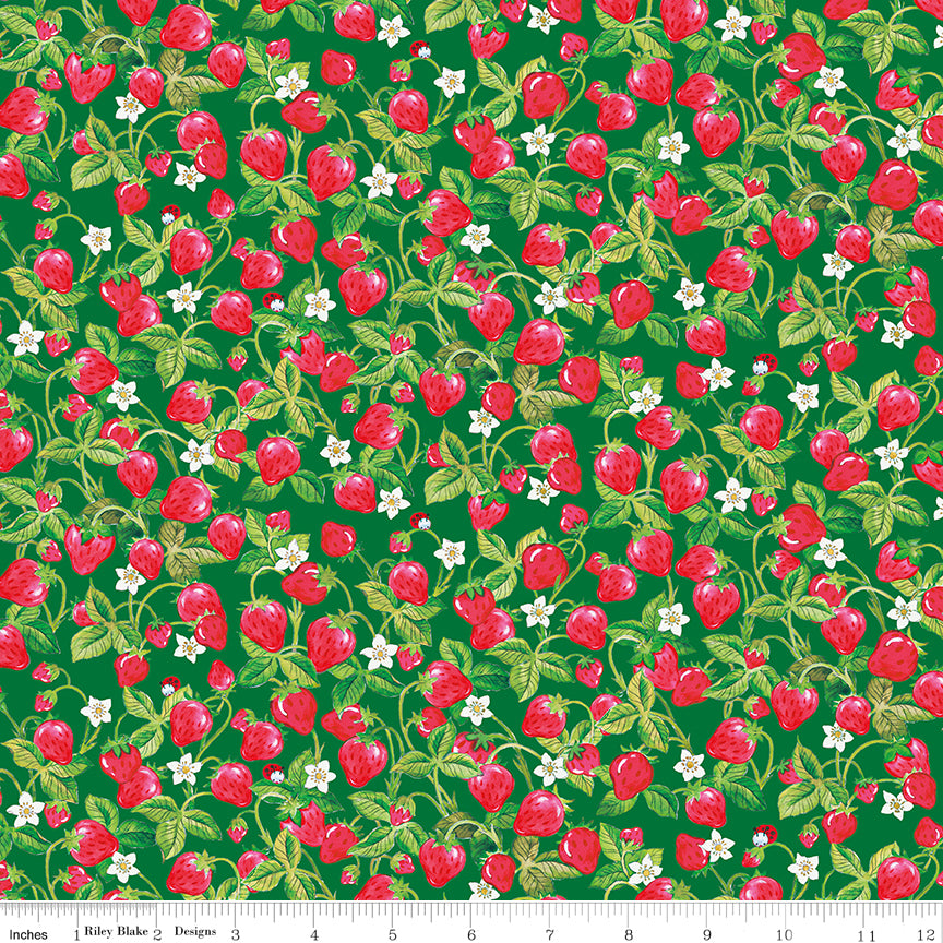 Fabric with strawberry pattern on a green background