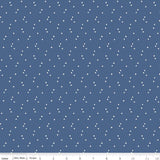 Blue fabric with white star pattern and a ruler at the bottom for scale.