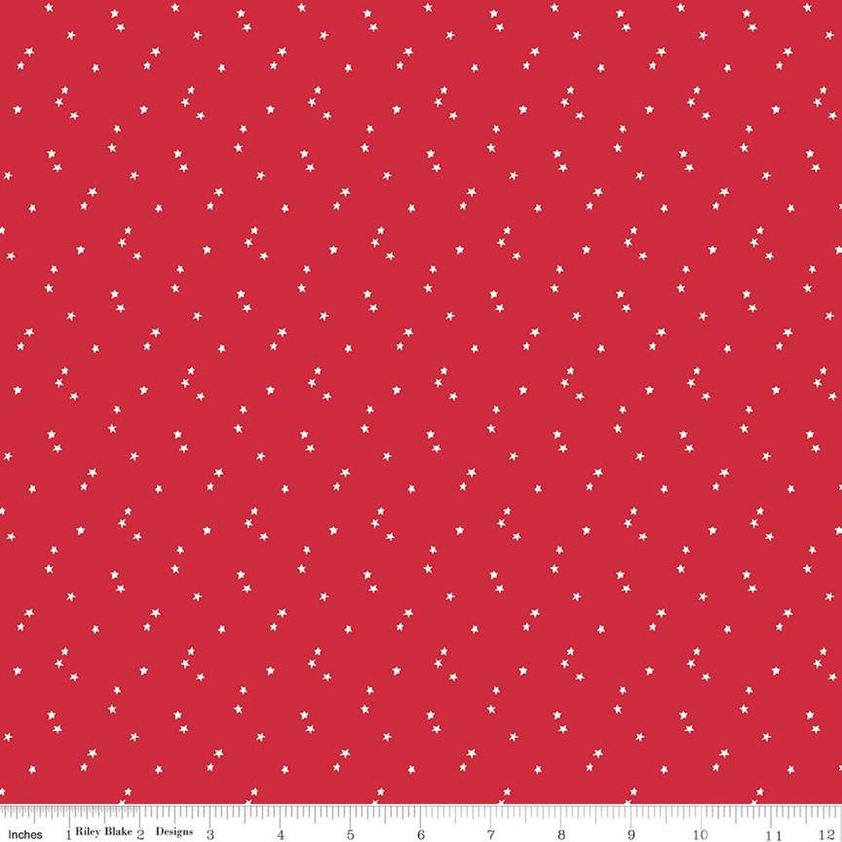 Red fabric with small white star pattern, brand 'Riley Blake Designs' visible