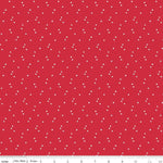 Red fabric with small white star pattern, brand 'Riley Blake Designs' visible