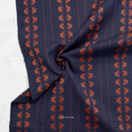 Fine and Dandy Deco Stripe Navy Spice Woven Fabric by Fableism