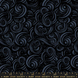 Black swirling pattern fabric with a ruler at the bottom, featuring Ruby Star Society label.