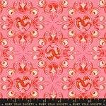 Decorative fabric pattern with red and white designs on a pink background, featuring Ruby Star Society label.