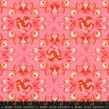 Decorative fabric pattern with red and white designs on a pink background, featuring Ruby Star Society label.