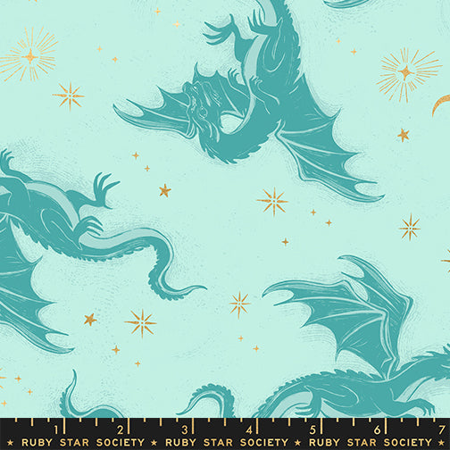 Pattern of dragons on a light blue background with gold stars, featuring the Ruby Star Society label.