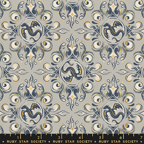 Decorative fabric pattern with dragons and swirls on a gray background, featuring Ruby Star Society label.