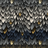 Patterned fabric with scalloped edge design featuring black, gold, and white colors.