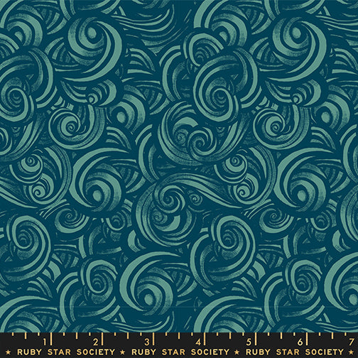 Patterned fabric with swirling designs in teal on a blue background, featuring Ruby Star Society label.
