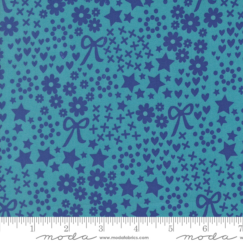 Blue fabric pattern with stars, flowers, and bows on a blue background, featuring Moda label.