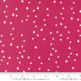 Fabric with white triangle pattern on a pink background, featuring Moda label.