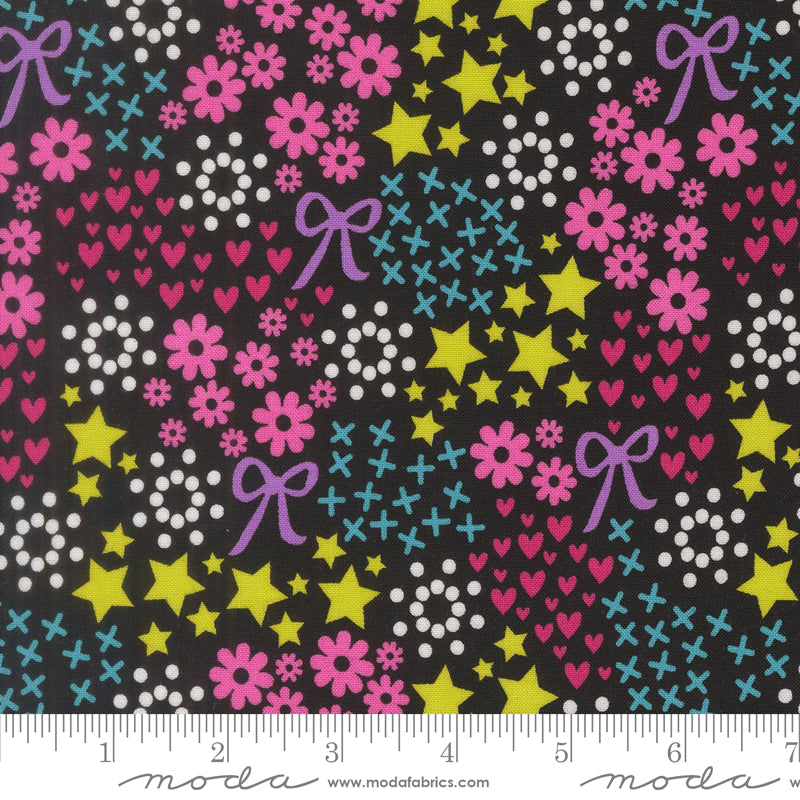 Colorful fabric pattern with stars, flowers, and bows on a black background, featuring Moda label.