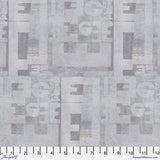 Fabric swatch with geometric pattern on a gray background
