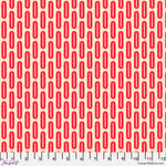 Red geometric pattern on a beige background with a ruler for scale.