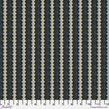 Patterned fabric with black, gray, and yellow design on a ruler for scale