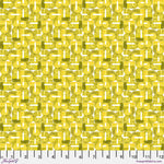 Patterned fabric with geometric design in yellow and green on a ruler background