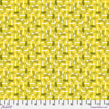Patterned fabric with geometric design in yellow and green on a ruler background