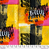 Colorful abstract fabric pattern with black text on a yellow and pink background, featuring a ruler at the bottom.