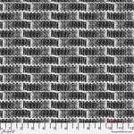 Black and white woven fabric pattern with a ruler at the bottom