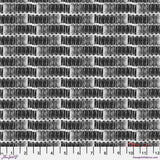 Black and white woven fabric pattern with a ruler at the bottom
