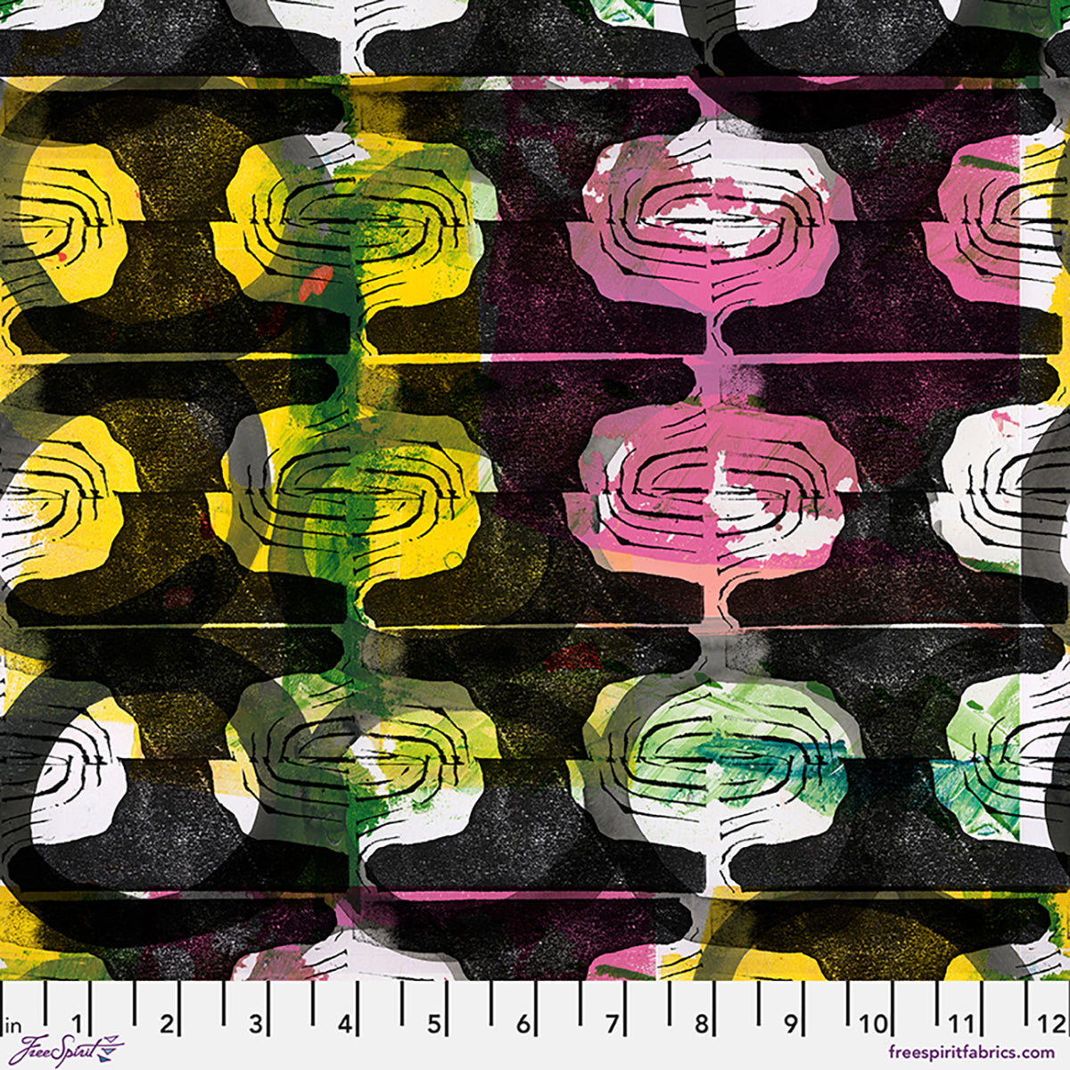 A close-up of a fabric pattern featuring repeating abstract oval and swirl motifs in yellow, pink, green, white, and black, with a white ruler along the bottom edge showing scale.