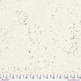 Speckled pattern fabric swatch on a white background with a ruler at the bottom.