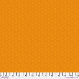 Solid orange fabric texture with a ruler at the bottom