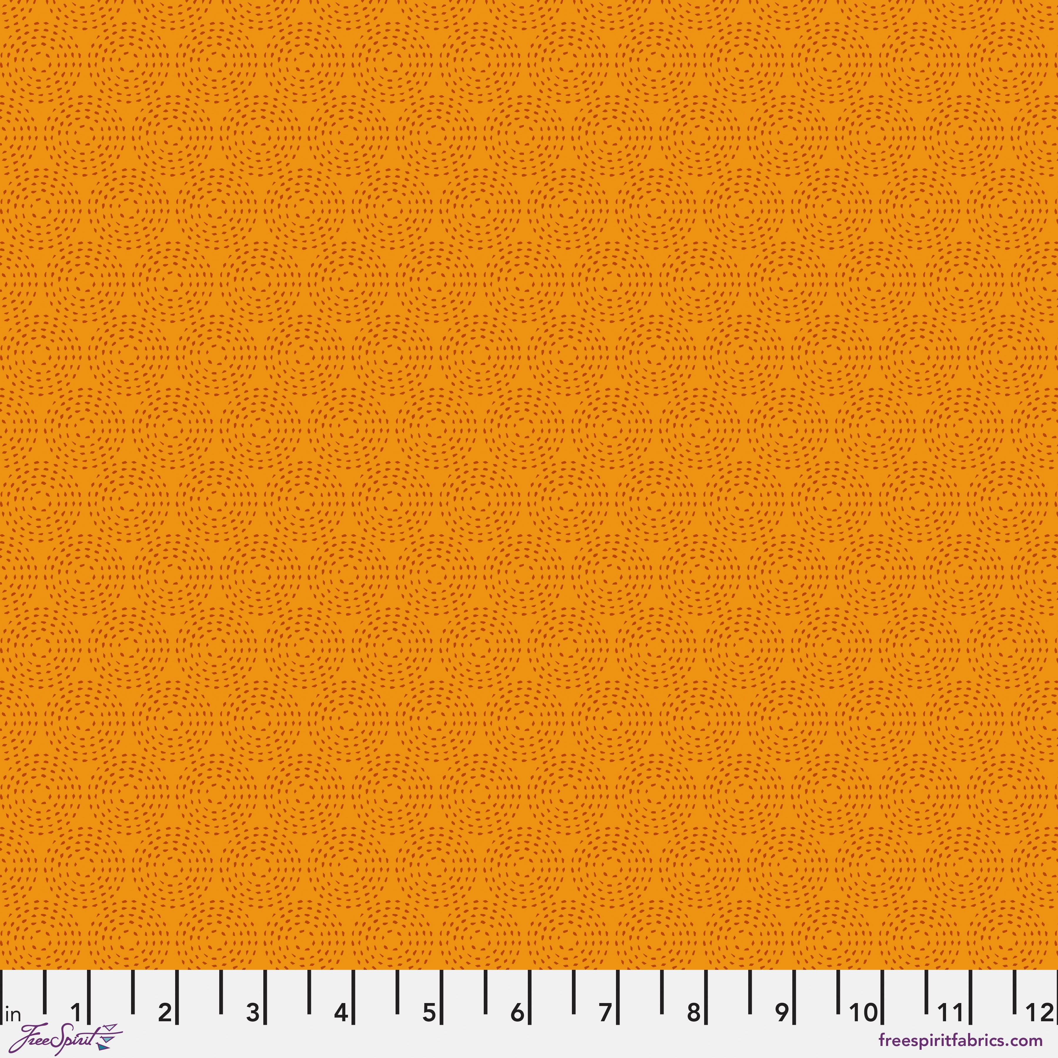 Solid orange fabric texture with a ruler at the bottom