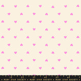 Pattern of small pink hearts on a beige background with Ruby Star Society label at the bottom.