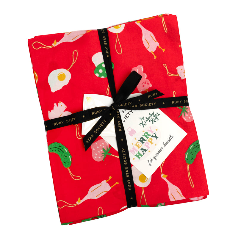 Red fabric with food pattern tied with a black ribbon on a white background