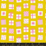 Pattern of pink and white gift boxes and bows on a yellow background with a ruler at the bottom.