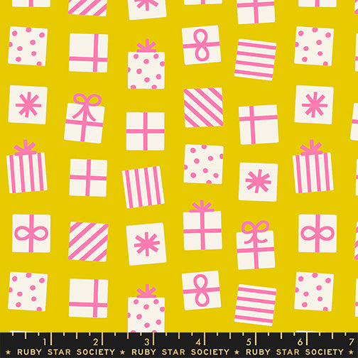 Pattern of pink and white gift boxes and bows on a yellow background with a ruler at the bottom.