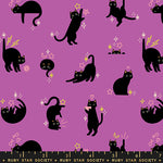 Pattern of black cats on a purple background with decorative elements, featuring the Ruby Star Society label.