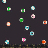 Pattern of colorful geometric shapes on a black background with Ruby Star Society label.