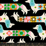 Patterned fabric with dogs and geometric shapes on a black background, featuring Ruby Star Society branding.